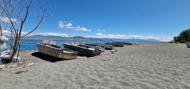 boats on the bank of lake Sevan in armenia rather old models