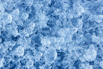 The natural chopped ice crystals. Shiny frozen abstract pattern for background or backdrop. View from above. - 723969605