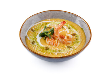 Pumpkin cream soup with shrimp on a white background studio shooting 1