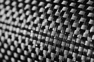 Abstract plastic braided background in close-up.