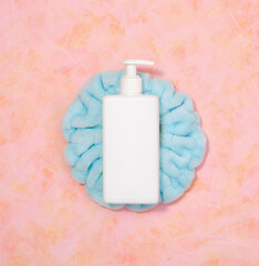 White wash gel dispenser and blue headband. Natural spa treatment, flat lay.