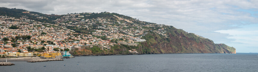 Fototapeta na wymiar Coastal views of Funchal, the beautiful capital city of Atlantic the island of Madeira, Portugal