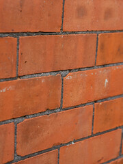 Obraz premium Red brick wall texture with grey grout
