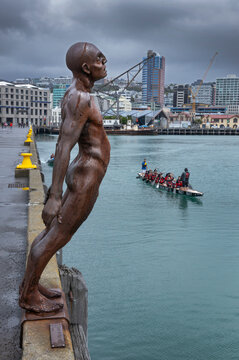 Queens Warf. Coast. Maori canoe. Queens Warf. Coast. Oriental bay. Skyline, Solace in the wind statue. Wellington New Zealand.