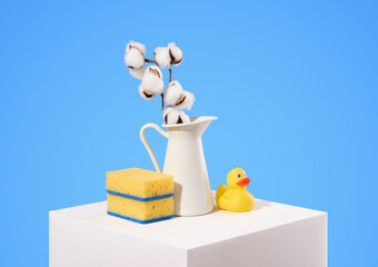 Laundry room and yellow rubber duck. Bright sponges and jug cotton.