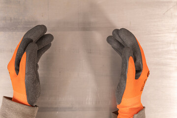 orange work gloves with plastic coating isolated