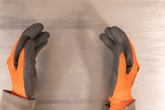 Orange Work Gloves With Plastic Coating Isolated