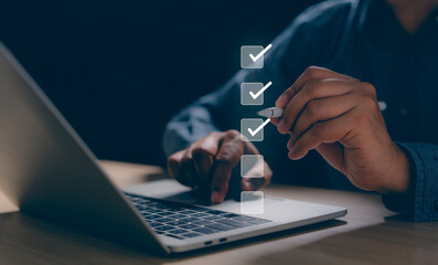 Businessman using pen and laptop online check survey filling out, digital form checklist...