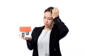 Portrait young asian businesswoman unhappy about loan of montage home isolated white background, expression and emotion, business woman annoyed and worried with debt house, stress and depressed.