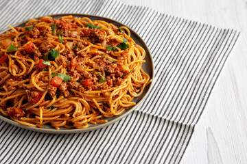 Homemade One-Pot Taco Spaghetti on a Plate, side view. Copy space.