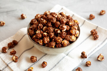 Homemade Chocolate Caramel Popcorn in a Bowl, side view.