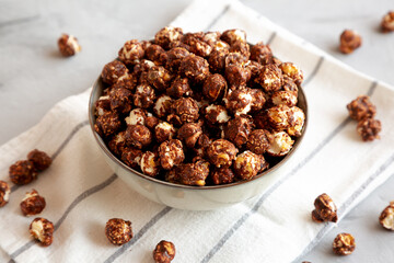 Homemade Chocolate Caramel Popcorn in a Bowl, side view.