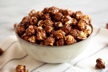 Homemade Chocolate Caramel Popcorn in a Bowl, side view. Close-up.