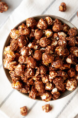 Homemade Chocolate Caramel Popcorn in a Bowl, top view. Flat lay, overhead, from above.