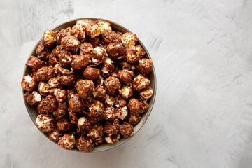 Homemade Chocolate Caramel Popcorn in a Bowl, top view. Flat lay, overhead, from above. Copy space.