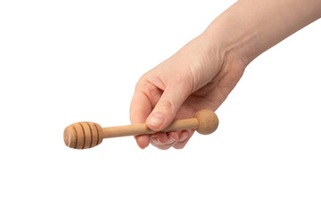 Honey dipper in woman hand isolated on a white background.