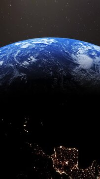 Vertical video of planet Earth slowly rotating revealing day to night concept with bright city lights