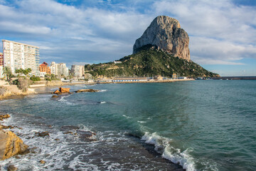 The Calpe Penyal d'Ifac massive limestone outcrop emerging from the Mediterranean sea in the...