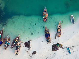 Bird view of wooden fisherman boats and white sandy beach at sunny day, Zanzibar,Tanzania