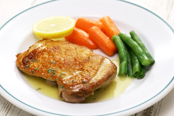 sauteed chicken with lemon butter sauce. close up