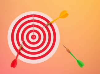 The idea of targeting and success, winning. Round board and arrows.