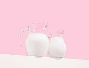 Jugs of white fresh milk on table. Healthy natural organic food.