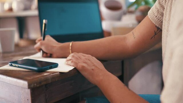 Woman, laptop and writing in pottery workshop, creative and workplace studio. Small business, craft and hobby for arts and crafts for artisan, working and taking notes for successful startup store