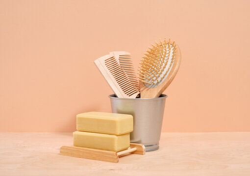 Wooden combs for hair care and two pieces of handmade soap. Eco friendly toiletries.