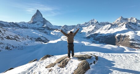 Panoramic landscape of Successful asian man celebrate and raising arms on mountain peak view point...