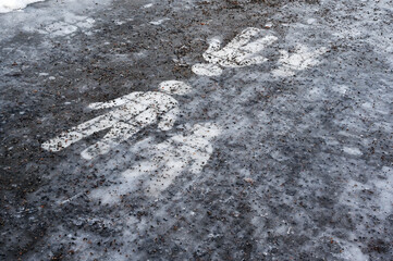  Ice covered sidewalk with a pedestrian path sign