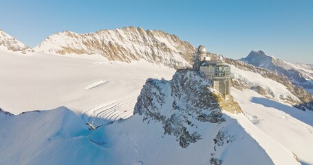 Panoramic landscape of Sphinx observatory and Aletsch glacier on Jungfraujoch Swiss Alps, Switzerland. Jungfrau top of europe in interlaken one of the highest mountain in the world on winter sunny day - Powered by Adobe