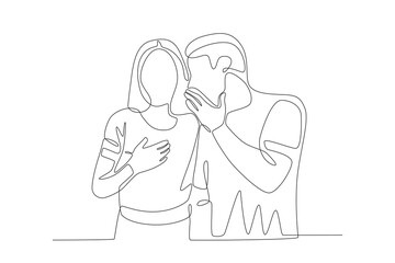 A man is whispering to his girlfriend