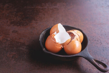 Eggshells on a small cast iron pan.