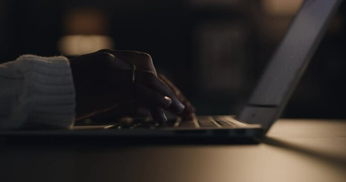 Laptop, typing and hands of person at night for working on online project, proposal and research. Remote work, freelance and closeup of computer keyboard for website, internet and networking at home