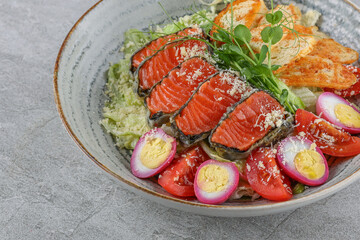 Salmon salad on a stone background studio shooting 4
