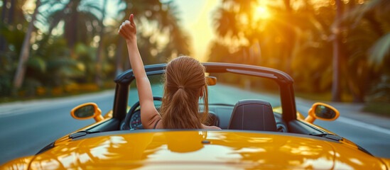 woman on a car with thumbs up