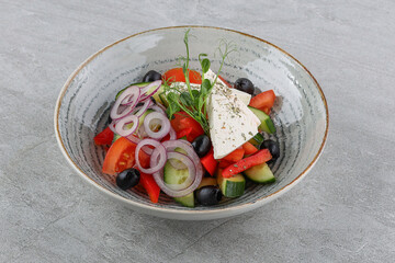 Greek salad on a stone background studio shooting 4