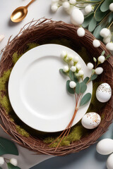 Table with served plates, napkin, cutlery, easter eggs in a bird's nest and eucalyptus branch.