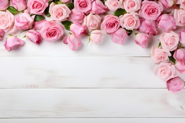 Pink roses on a white wooden background with copy space 