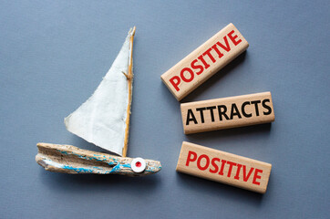 Positive attracts Positive symbol. Wooden blocks with words Positive attracts Positive. Beautiful...