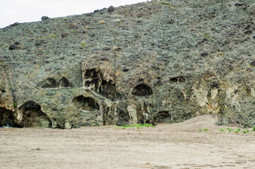 Ancient cave  on the beach "Playa de los Muertos" Cabo Gata, Almeria, Espain