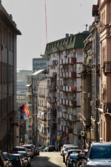 Historic urban building facades along a narrow city street © Miros