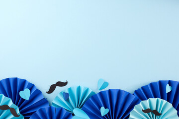 Daddy's delight: an extravaganza of fatherly love. Top view composition of paper holding fans,...