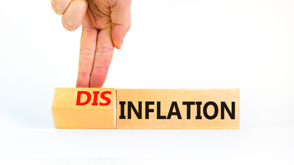 Inflation or disinflation symbol. Concept word Inflation Disinflation on beautiful wooden cubes. Beautiful white background. Businessman hand. Business inflation disinflation concept. Copy space.