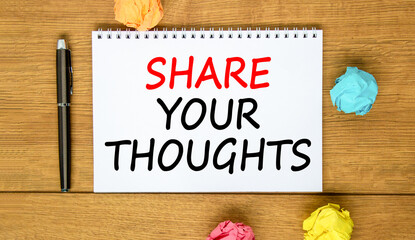 Share your thoughts symbol. Concept words Share your thoughts on beautiful white note. Beautiful wooden background. Black pen. Colored paper. Business share your thoughts concept. Copy space.