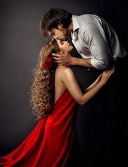Spanish Girl. Woman in Red Dress with Boyfriend side view Kiss.  Valentines Day