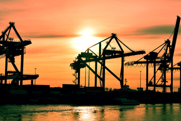 Container crane by sunset