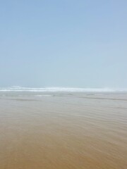 foggy ocean coast, fog at the ocean beach