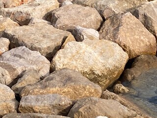Large Sandstone Boulders in a Group  by the Water