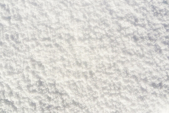 Abstract background of hardened snow, top view.